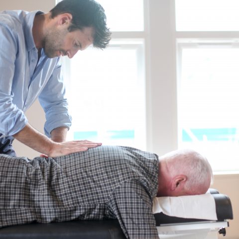 Man receiving chiropractic care at Kasa Chiropractic Bristol.