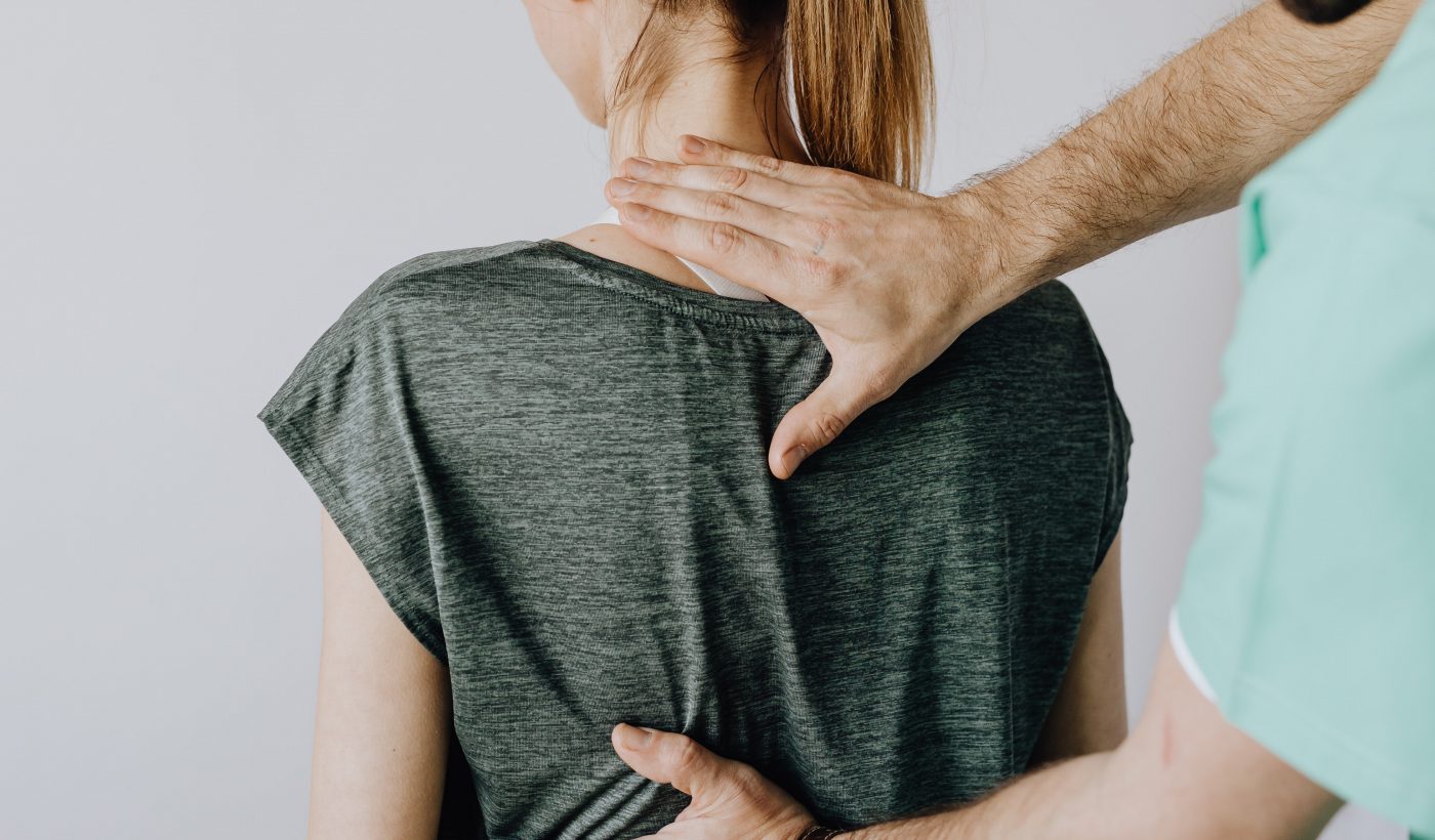 a chiropractor giving a chiropractic adjustment to a patient