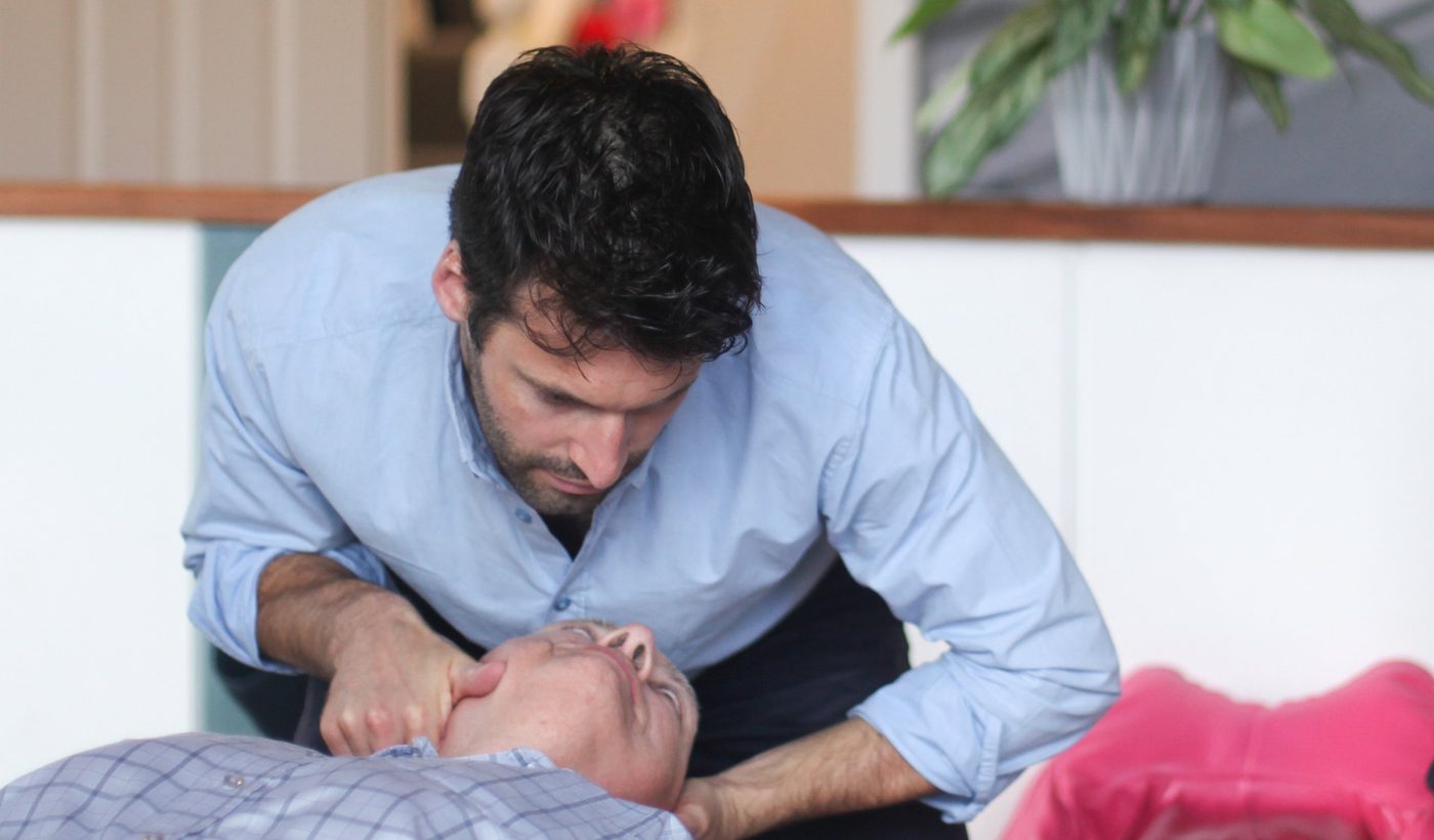Chiropractor adjusting a patient’s neck at Kasa Chiropractic in Clifton, Bristol